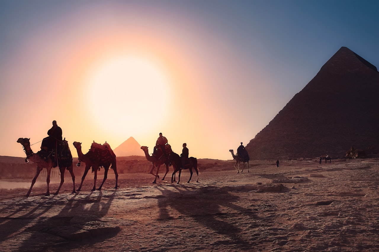 Pyramids of Giza and camel caravan, Egypt