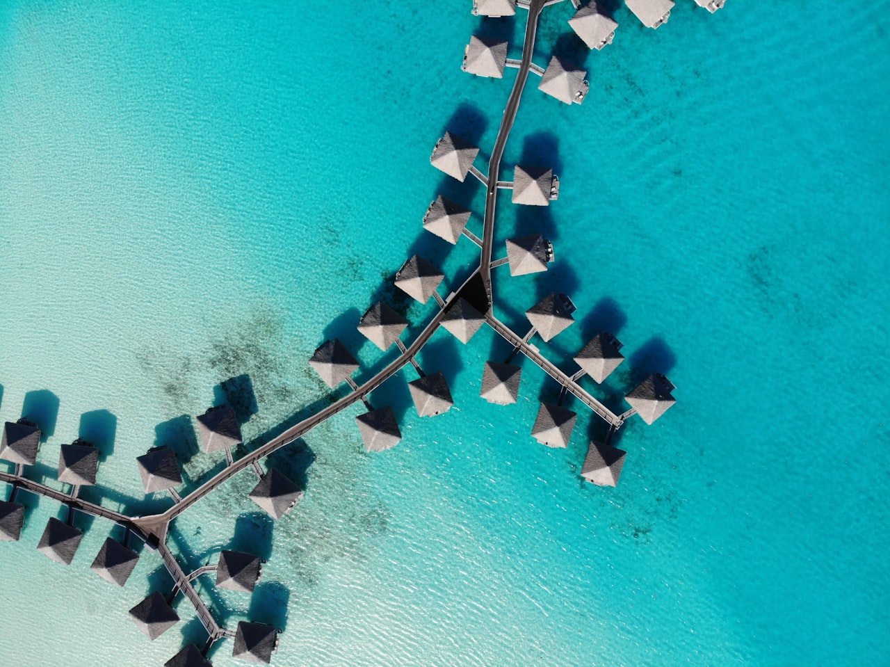 Overwater bungalows above the lagoon of Bora Bora, French Polynesia