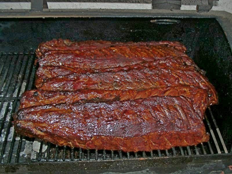 Smoked pork ribs glazed with dark BBQ sauce
