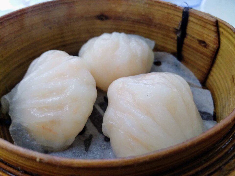 Dim sum in bamboo steamers, shrimp har gow and dumplings