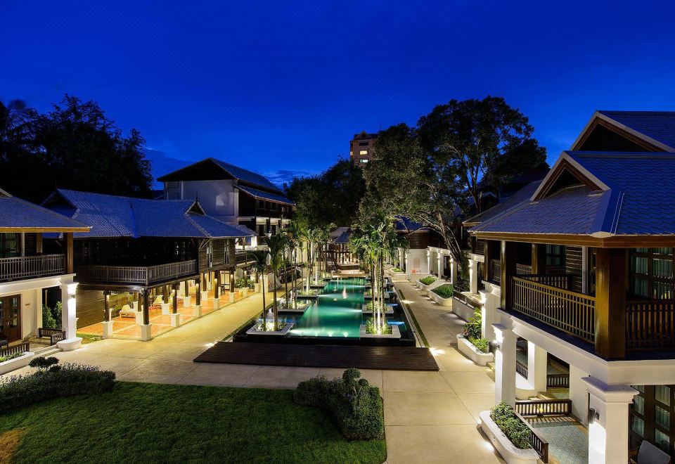 Night aerial of Colonial-Lanna resort with illuminated pool