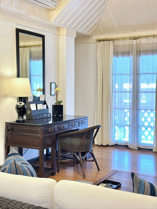 Suite with antique Chinese desk and latticed windows