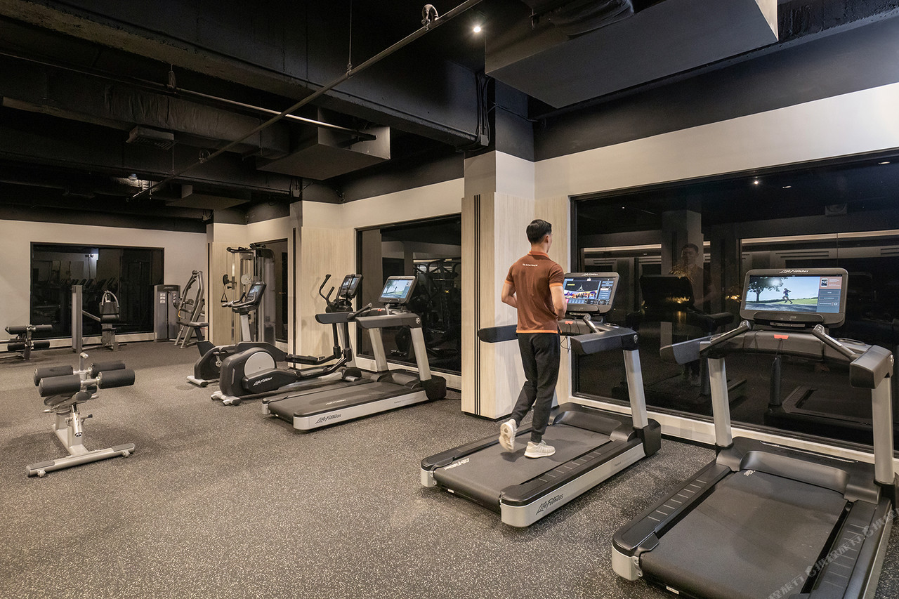 Hotel fitness centre with treadmills and floor-to-ceiling windows
