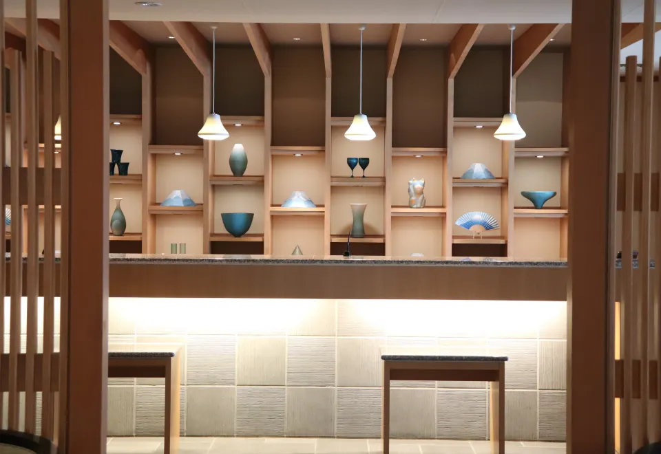 Kozantei Ubuya lobby display with handcrafted Japanese pottery and elegant timber architecture
