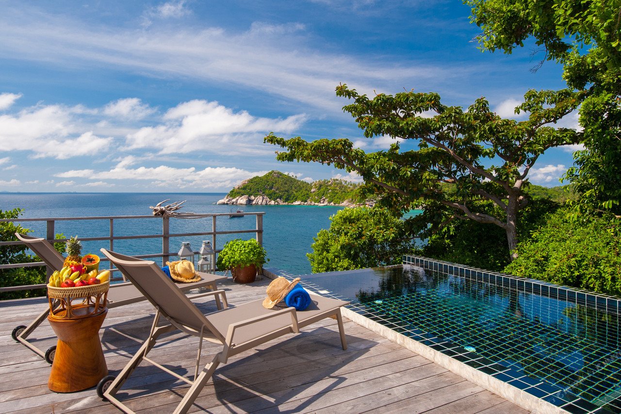 Private clifftop infinity pool with sun loungers and Koh Tao sea views