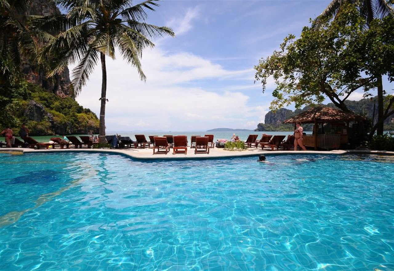 Beachfront pool at Railay Bay Resort against a limestone cliff backdrop