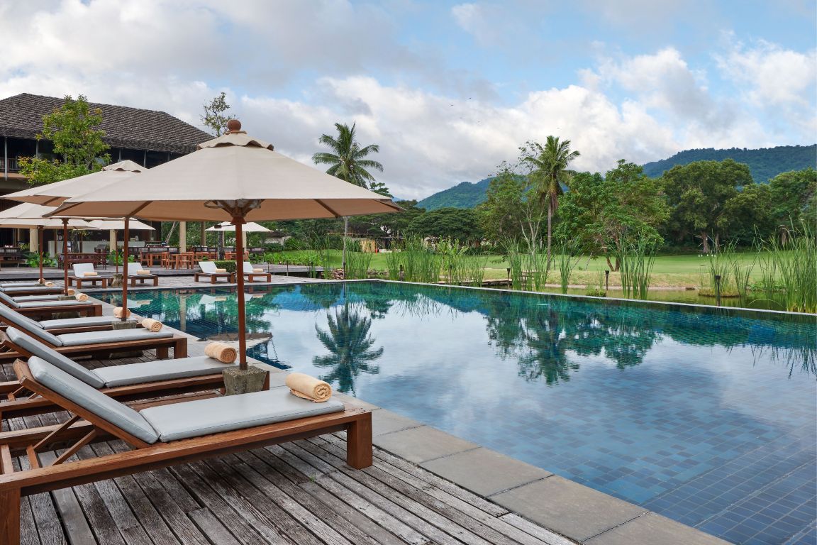 Infinity pool at Kirimaya Khao Yai overlooking the golf course and mountains