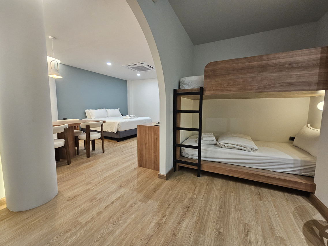 Family room with bunk beds and a built-in dining corner