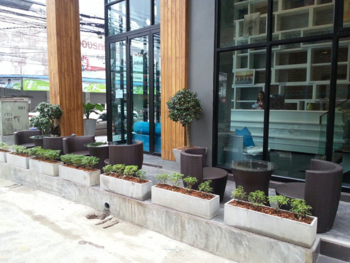 Front terrace seating and the glass lobby entrance