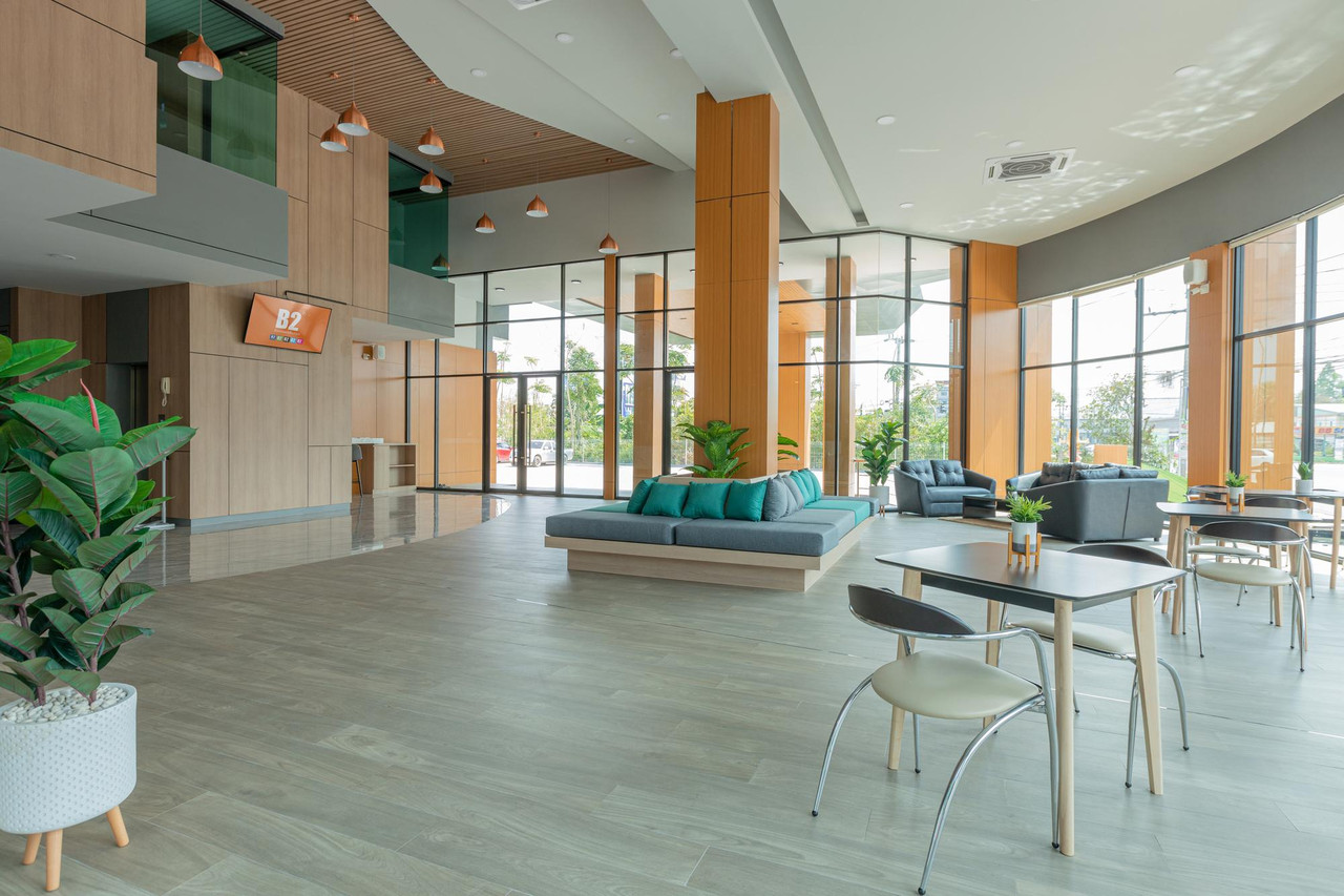 Bright open lobby at B2 Surat Thani Premier with full-height glass walls