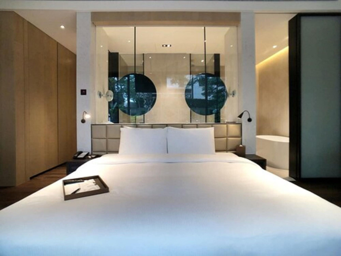 A guest room at Hotel MVSA Taipei in its wine-themed design style